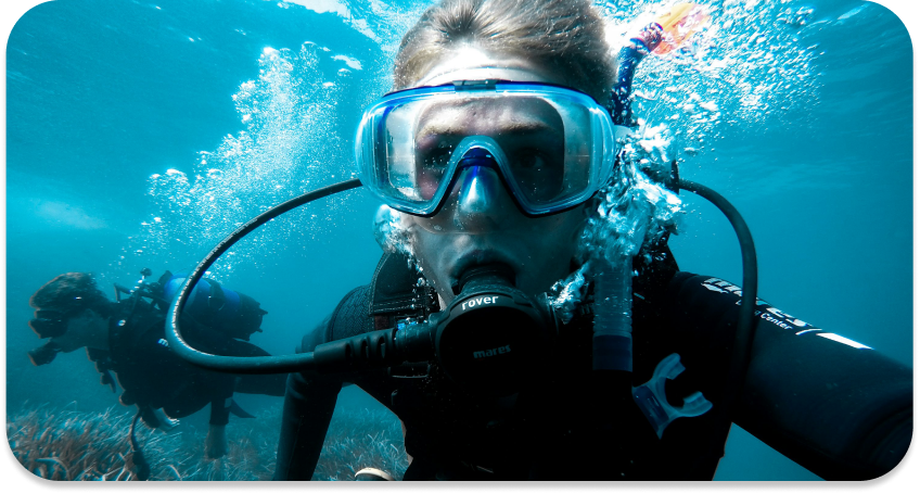 Diver underwater with bubbles